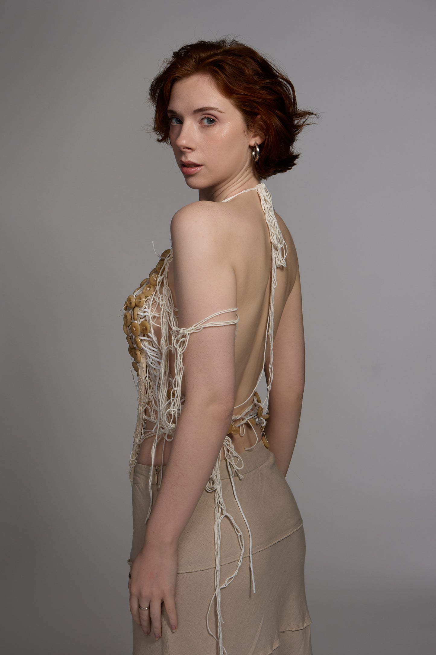 Yarn and buttons corset